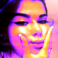 Onlyfans Model Aitana Sharing a Purple-Tinted Photo on Social Media