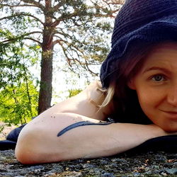 Young Female Resting on Rock
