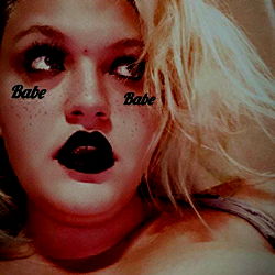 Bold and Edgy Model Striking a Pose with Dark Lipstick