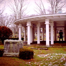 Serene Cemetery Scene with White Gazebo