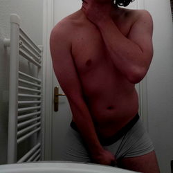Shirtless Adult Male in Bathroom