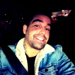 A Smiling Man in a Jeep