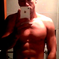 Fitness Model Alex Quintana Showcases Abs in Bathroom Mirror