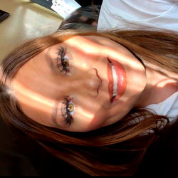 A Young Adult Smiling Brightly