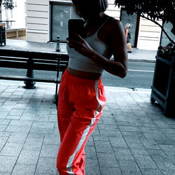 Amy Strutting on a Sidewalk in Casual Sportswear