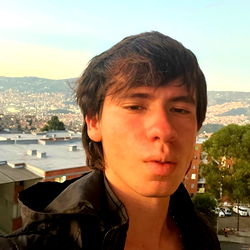 Sebastian Quesada, young man in urban setting, possibly musician