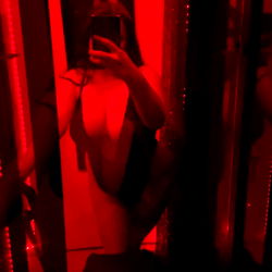 OnlyFans Model Babygirl_Drizz Poses in Red Light Room