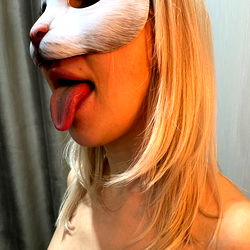 Model in Mask and Lingerie on Wall