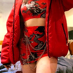 Young Model Posing with Cat in a Red Jacket