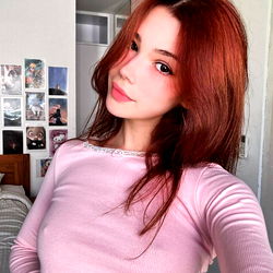 Gorgeous Red-Haired Woman Striking a Pose for Instagram