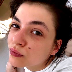 Janoushka, a young adult woman with a vibrant and lively personality