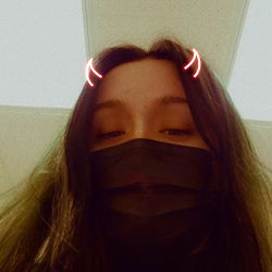 Adora Vixen, A Young Female Model Posing in Her Photo Shoot with Playful Earrings