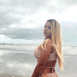 Beautiful OnlyFans Model Bite Posing on a Beach