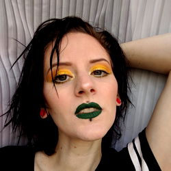 Apollobaby, vibrant makeup artist in chic pose