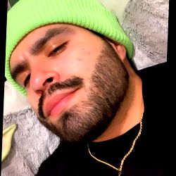 Tony, the Bearded Man in a Sweater and Cap, Posing with Confidence