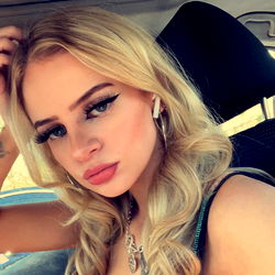 Ash, a Philly-based OnlyFans model, in car