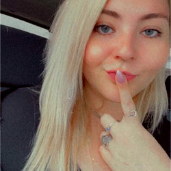 Woman with Hand on Face in Car