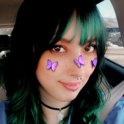 Model with Purple Butterfly Makeup and Stylish Tattoo