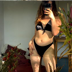 Fitness Model Posing in Mirror