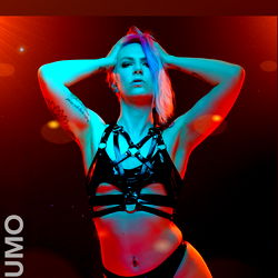 Blondiekitty in a Striking Performer's Costume on Stage