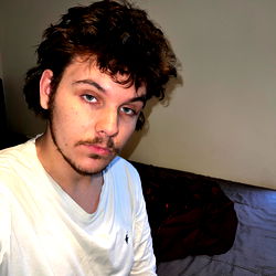 Stylish Model with Tattoos in a Chic Hotel Suite