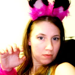 A Female OnlyFans Model Posing for a Selfie in Cat Ears