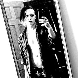 Emo Punk Model with Shaved Head and Plaid Shirt