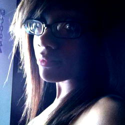 Ana, A Young Model with Long Hair and Glasses