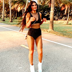 Mary, an OnlyFans model strutting in a sporty swimsuit