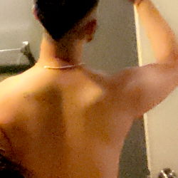 A Young Man Taking a Selfie in the Bathroom