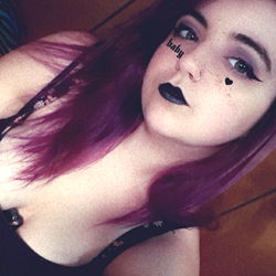 Caitlin Alexis in a playful pose on OnlyFans