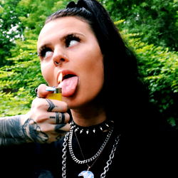 Gigi Rose - Tattooed Model in Playful Pose