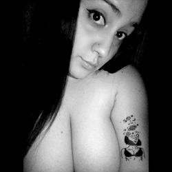 Vibrant Tattooed Woman Posing for the Camera