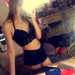 OnlyFans Model Poses in Bedroom Mirror