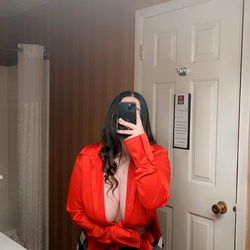 A person in a bathroom mirror