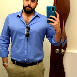 A Man in a Bathroom Mirror