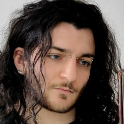 Fashionable Long-Haired Man with Tattoos