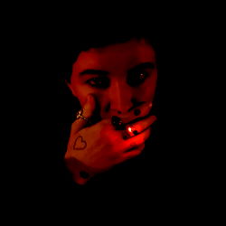 CoffinZer0 with a heart tattoo on their finger ❤️