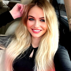 Beautiful Blonde Woman Posing in Car