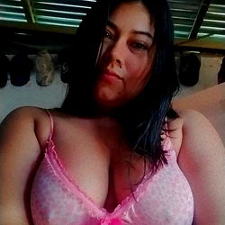 Andrea Rojas, a Puerto Asís model in vibrant pink lingerie