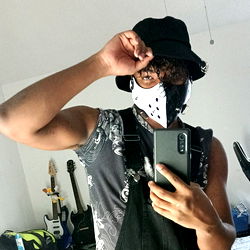 Person in Hat with Mask and Phone