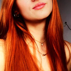 Stylish Red-Headed Woman Posing for the Camera