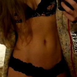 AlixxRae in a black lingerie set, body-confident