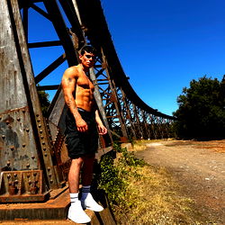 Muscular OnlyFans Model Dyl Posing Near Abandoned Bridge and Tracks