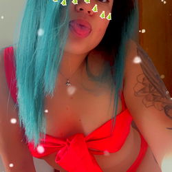 Amarie, the OnlyFans Model with Stunning Blue Hair and a Red Bikini, Poses for a Christmas-Themed Shoot