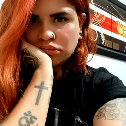 A Model with Red Hair and Tattoos