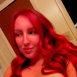 Red-headed woman in red hair and red dress