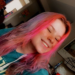 Smiling Woman with Pink Hair
