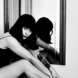 A Model in a Bathroom Mirror