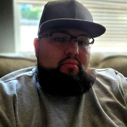 James from Onlyfans: A Man with a Beard and Glasses